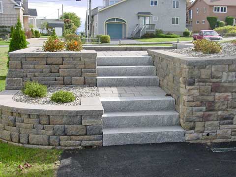 natural stone steps with a prefab block wall