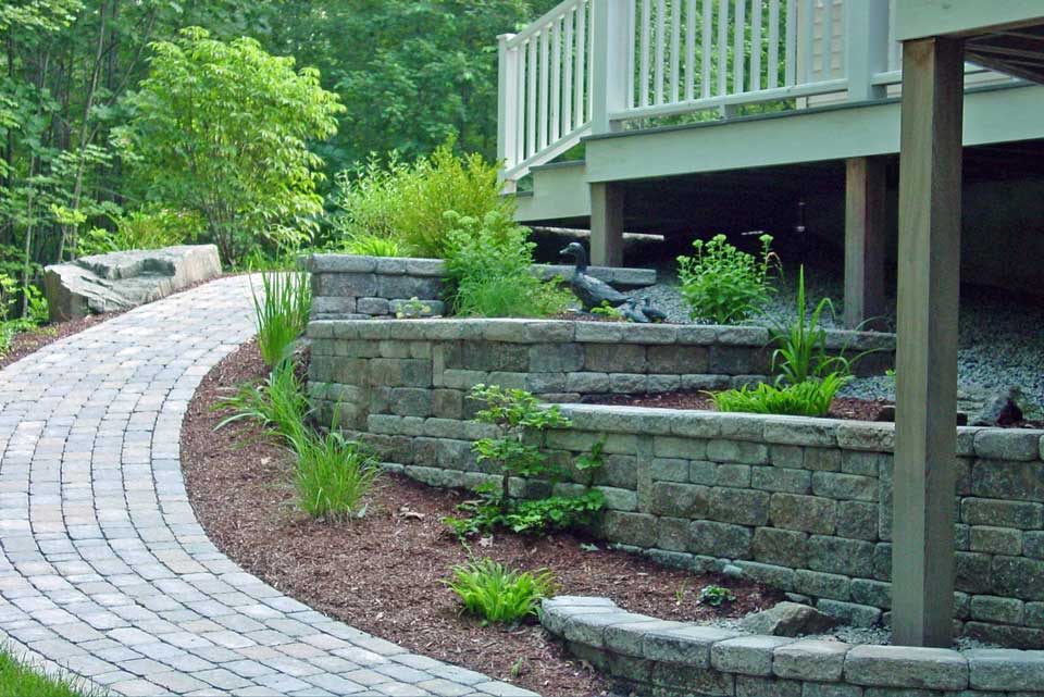 terraced plantings adjacent to paver walkway