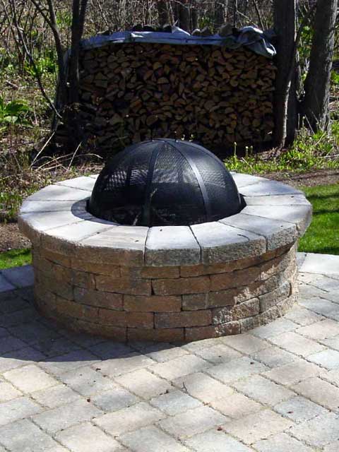 custom firepit built with spark guard cover