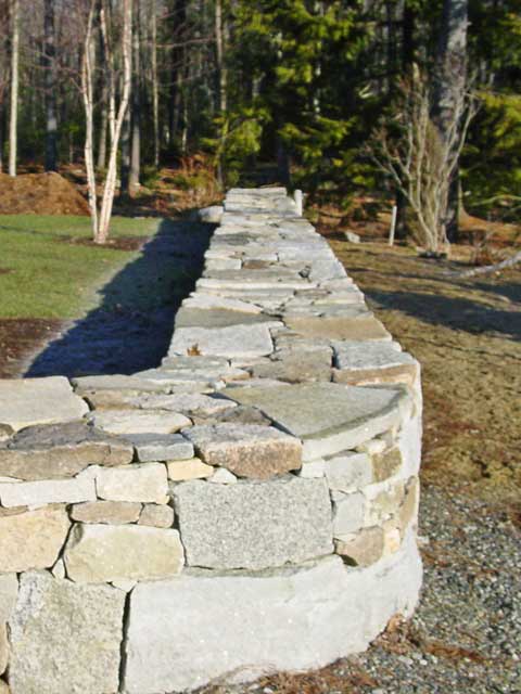 stone wall with randomly-shaped stones and crisp edges