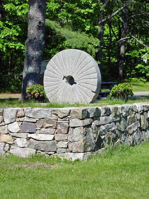 stone wall with accent stone wheel