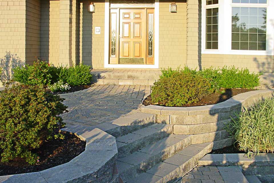 front entry with pavers and natural stone steps