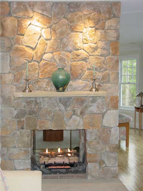floor to ceiling fireplace with stone veneer